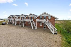 a row of houses with stairs on the side of it at 0294-Romo-Vestergade-3-Ap-57 in Havneby +20 photos