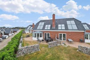 an aerial view of a large brick house at 0287-Romo-Sonder-Frankel-28 in Havneby