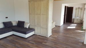 a living room with a couch and a cabinet at Casa de Marinero Villa in Fish Fish +40 photos