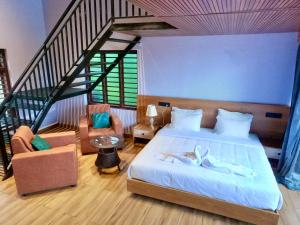 a bedroom with a large bed and a staircase at Mercure Resort Wayanad in Mananthavady +34 photos