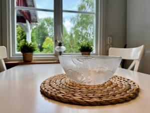 a glass bowl sitting on top of a table at House near forest and water in Hagfors