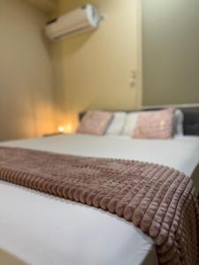 a pair of beds in a hotel room at Milenio in Manta