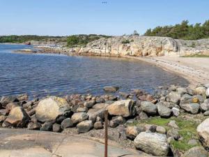 a group of rocks on a beach near the water at Apartment Strömstad, Lökholmen in Strömstad