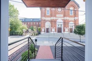 a view of a brick building from a balcony at Monastery Guest House 2BR Option in Cincinnati