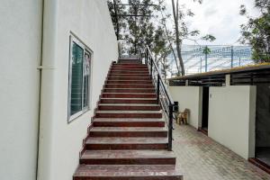 a stairway leading up to a building at SPOT ON Mango Leaf Restaurant in Bayappanhalli