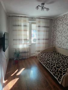 Postel nebo postele na pokoji v ubytování Spacious Buiucani Apartment