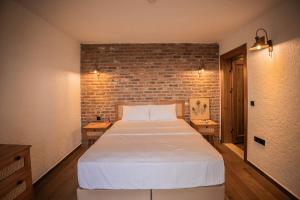 Ένα ή περισσότερα κρεβάτια σε δωμάτιο στο Käira Kazdağları +33 φωτογραφίες