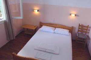 Postel nebo postele na pokoji v ubytování Αlexandros apartment