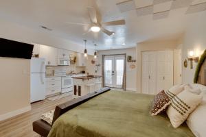 a large bedroom with a bed and a kitchen at Hike and Explore in Cedar City! Studio Guest Suite in Cedar City