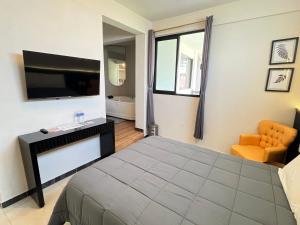 TV a/nebo společenská místnost v ubytování HOTEL BOUTIQUE ÁRBOL De LA VIDA