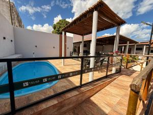 a view from the deck of a villa with a swimming pool at Village Comfort Hotel in Canindé de São Francisco