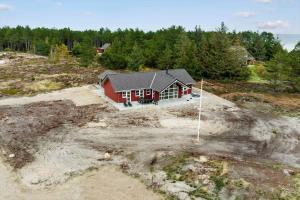 an overhead view of a house in a field at 0257-Romo-Chresten-Krommes-Vej-9 in Tagholm