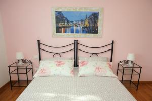 Casa Vacanze Riviera del Brenta tesisinde bir odada yatak veya yataklar