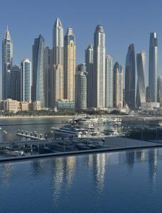 a view of a city with a harbor with boats at KeyRock - Dubai Marina Stay with Pool & Gym in Dubai