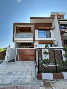 a house with a fence in front of it at 3 bed Designer House in Islamabad