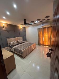 a bedroom with a bed in a room at 3 bed Designer House in Islamabad