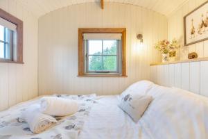 Voodi või voodid majutusasutuse Hillside Hideout toas