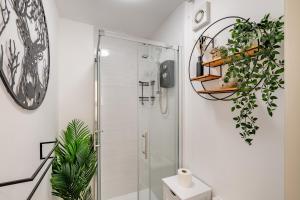 a bathroom with a shower and a toilet at Elmsleigh Nook in Rothbury +11 photos