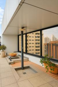 a balcony with a view of a city at BOOK A FLAT Alameda Lorena Jardins in Sao Paulo