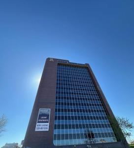 a tall building with blue sky in the background at Urban Hideaway - 201 in Tulsa