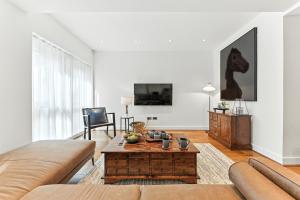 a living room with a couch and a coffee table at Springfield Two in Harrogate