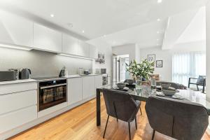 a kitchen and dining room with a table and chairs at Springfield Two in Harrogate