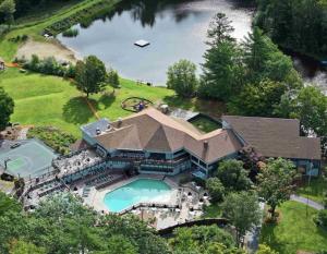 an overhead view of a large house with a swimming pool at Mountain cabin with views, privacy, and more. in Campton