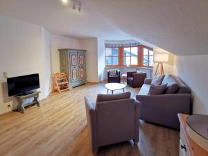 TV a/nebo společenská místnost v ubytování Ferienwohnung Dorfplatz + 4 fotografie