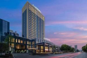 a rendering of a tall building in a city at Le Meridien Shaoxing Yuecheng in Shaoxing