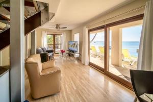 a living room with a view of the ocean at Seven Mile View Condo #4 in West Bay