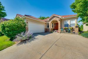 a house with a driveway in front of it at Pet-Friendly Longmont Home with McIntosh Lake Access in Longmont