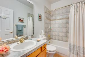 a bathroom with a sink and a tub and a toilet at Pet-Friendly Longmont Home with McIntosh Lake Access in Longmont +34 photos