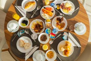 a round table with plates of food on it at Crocobeach Hotel in Fortaleza