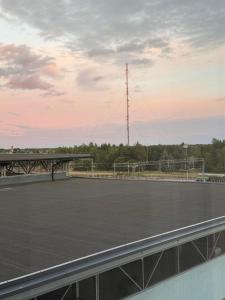 a tennis court on the roof of a building at Videsten city center stay in Kokkola