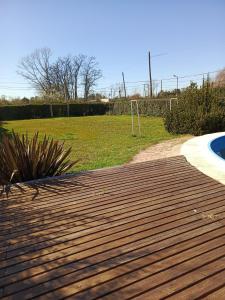a wooden walkway leading to a field with a goal at Quinta "El Ángel Gabriel" in Gowland