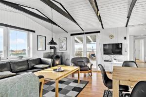 a living room with a couch and a table at 0115-Romo-Lakolk-225 in Lakolk