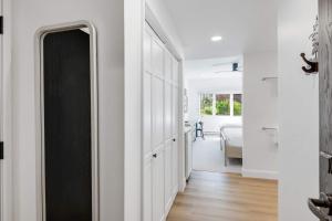 a hallway with a black door and a bedroom at The Charter at Beaver Creek E135 in Beaver Creek +6 photos