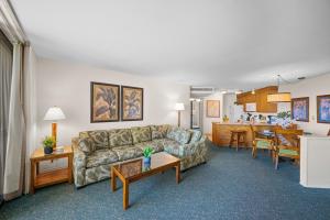 a living room with a couch and a kitchen at Kaanapali Shores 512 in Kaanapali