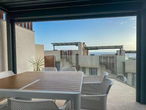 a table and chairs on a balcony with a view at Luxury House in El Mirador Calaceite Torrox Costa, Hus 19 in Torrox Costa