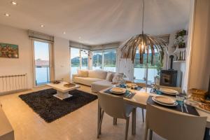 a living room with a couch and a table at Montserrat Apartment in Callús