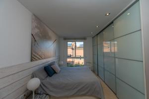 a bedroom with a bed and a window at Montserrat Apartment in Callús +64 photos