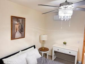a bedroom with a bed and a ceiling fan at Casa Cabo Paraiso in Cabo San Lucas +28 photos