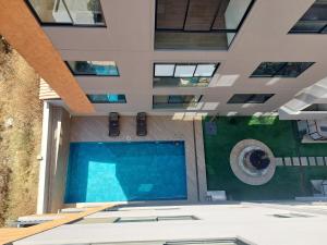 a swimming pool in the middle of a building at Prados del Oeste in Cochabamba