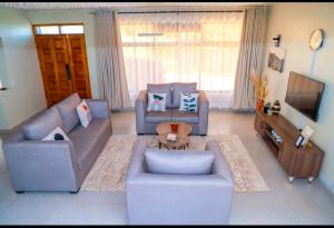 Posezení v ubytování Pelican lodge Spacious villa 3BR Ensuite