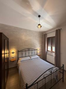 a bedroom with a large bed in a room at La Chianconata Rooms in Vieste