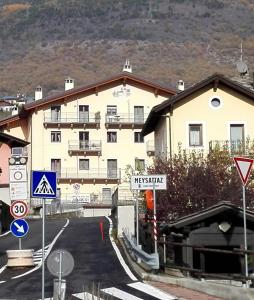 a large building with a lot of signs in front of it at Appartamento Le Moulin in Aosta