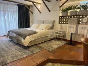 a bedroom with a bed in a room at Blau Hotel&Café in Sopo +7 photos