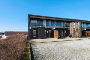 a large building with a lot of windows at 0274-Romo-Nordre-Havnevej-42 in Havneby