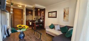 a living room with a couch and a table at Departamento Edificio El Salar Calama in Calama