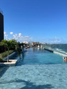 a swimming pool on top of a building at Art Studio Carimbamba, Jóia Rara! in Salvador
